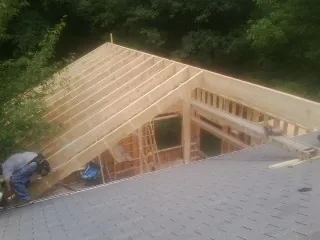 Framing a new roof addition that ties into an existing shingle roof in Deadwood